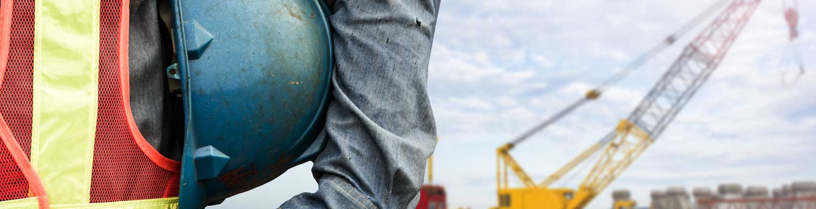 Image of a building contractor holding a hard hat at one of Fox Building Company's commercial construction sites.  Fox is a fully-licensed general contractor in Atlanta GA.